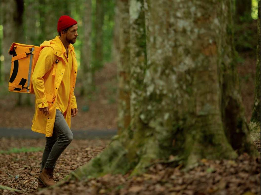 man-runs-through-forest