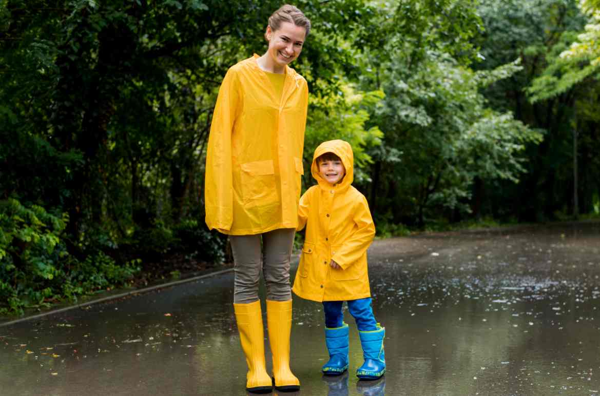 mother-son-holding-hands-while-raining