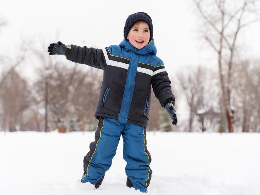 close-up-n-happy-kid-playing-snow