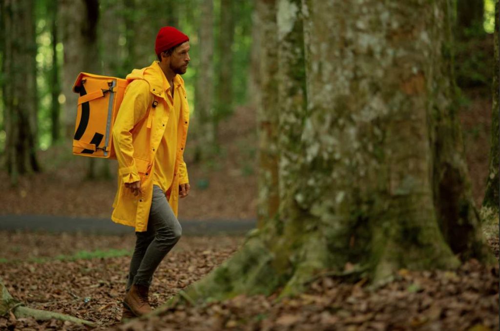 man-runs-through-forest